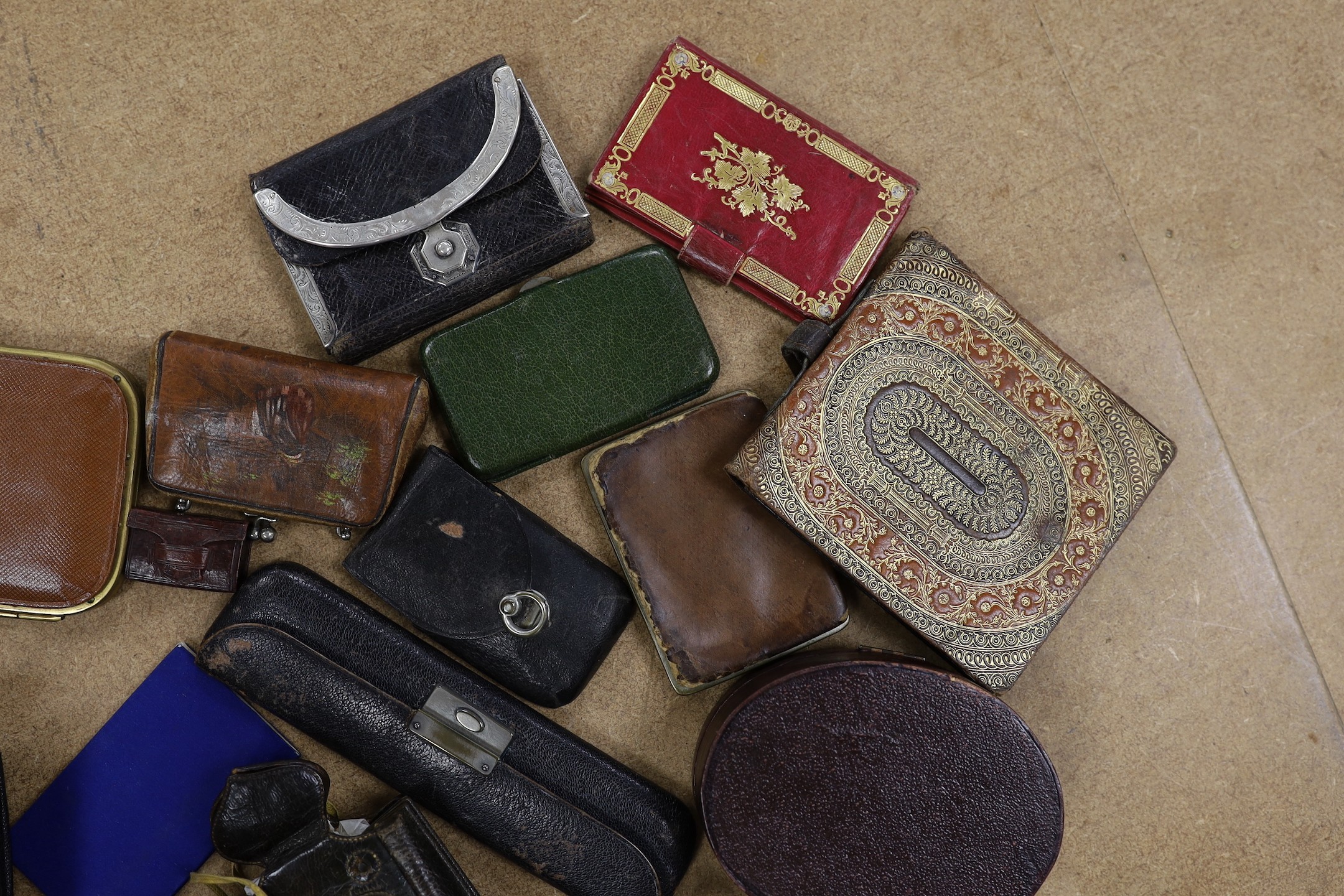 A large collection of unusual Morocco leather purses, bags and containers, some embossed and some with petite point embroidery, mostly 19th century.